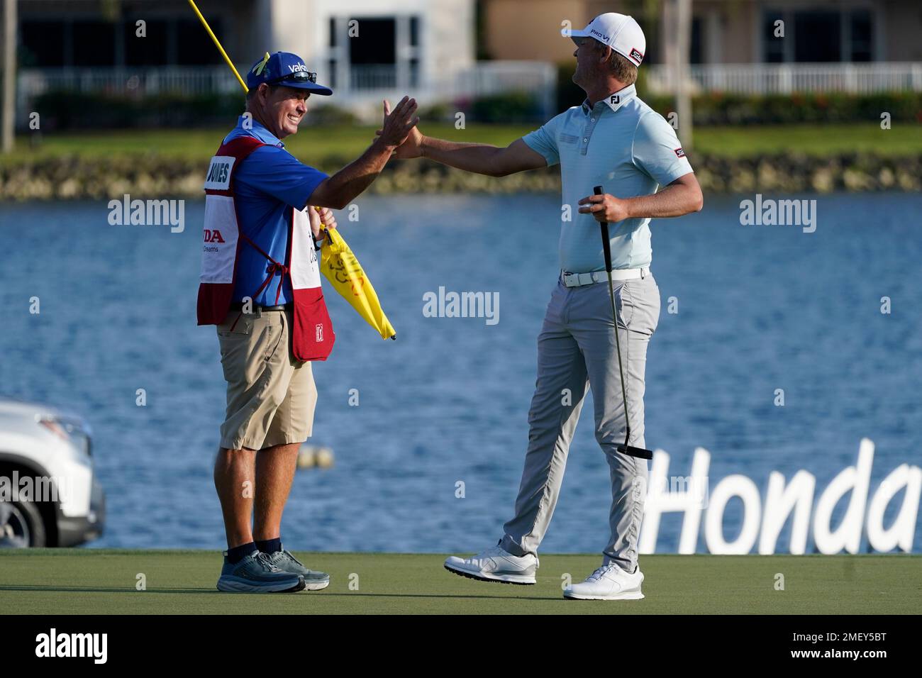 Matt Jones, right, of Australia, celebrates with his caddie Lance