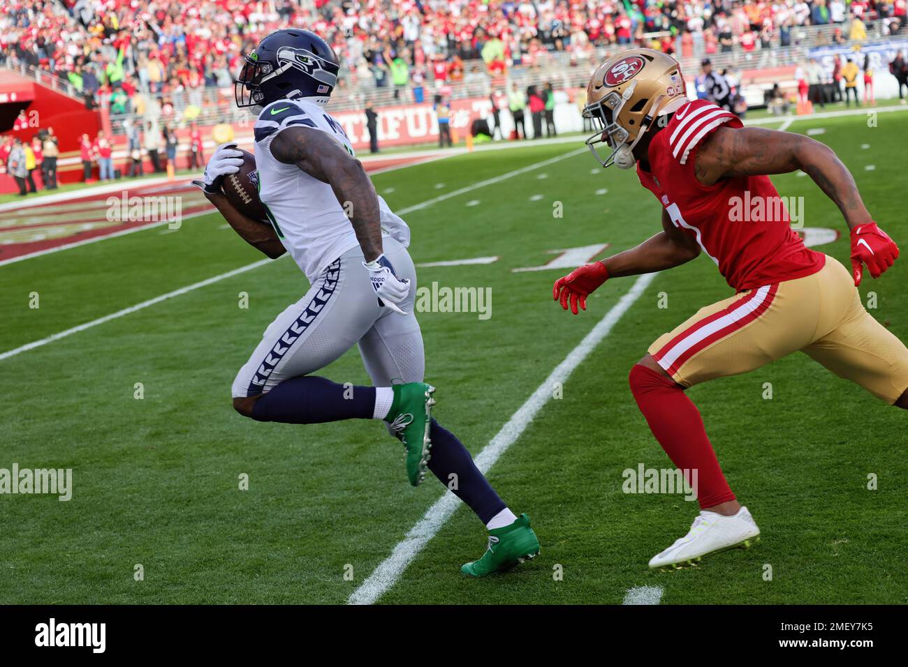 Seattle Seahawks wide receiver DK Metcalf (14) is chased by San Francisco 49ers cornerback Charvarius Ward (7) during the NFL Wildcard Game Saturday January 14, 2023 at Levi’s Stadium in Santa Clara, California.  The 49ers won the game 41 to 23. (Peter Read Miller / Image of Sport) Stock Photo