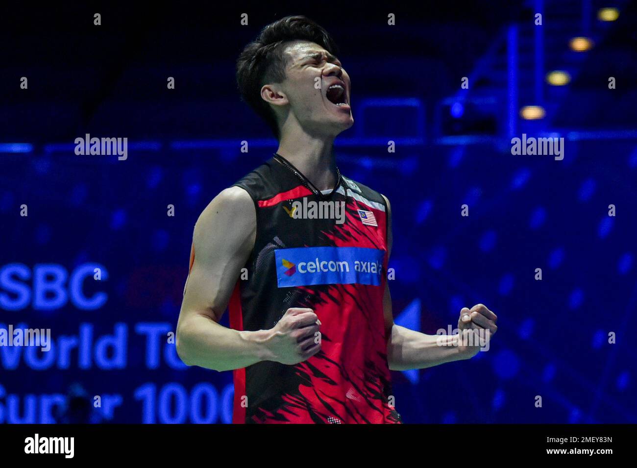 Malaysias Lee Zii Jia celebrates after winning Denmarks Victor Axelsen during the mens final match of the All England Open Badminton Championships at the Utilita Arena in Birmingham, England, Sunday March 21,