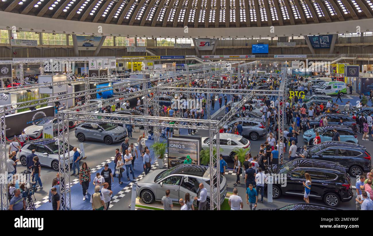 Belgrade, Serbia - May 12, 2022: Crowd of Visitors People BG Car Show in Large Fair Hall Expo. Stock Photo