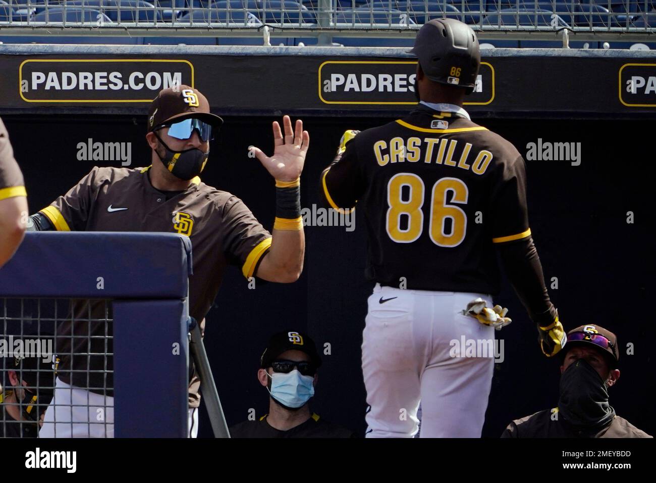 San Diego Padres' Ivan Castillo (86) returns to the dugout after
