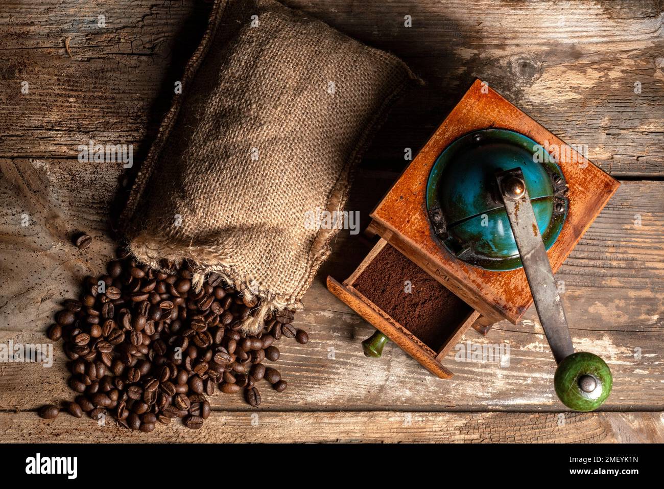 Vintage manual spice grinder on wooden background Stock Photo - Alamy