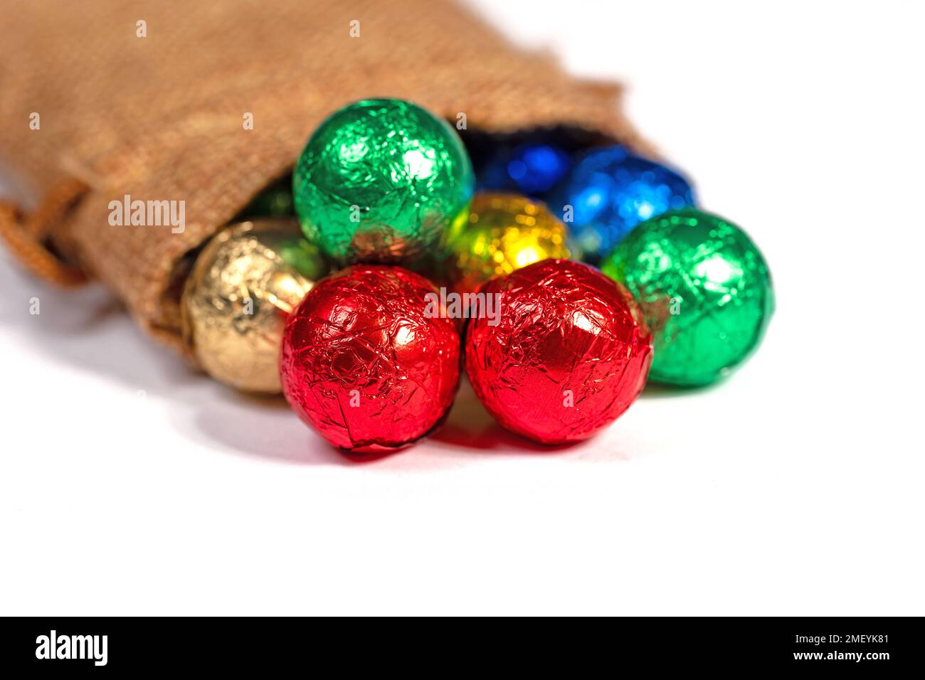 Colorful chocolate balls in a jute sack Stock Photo Alamy