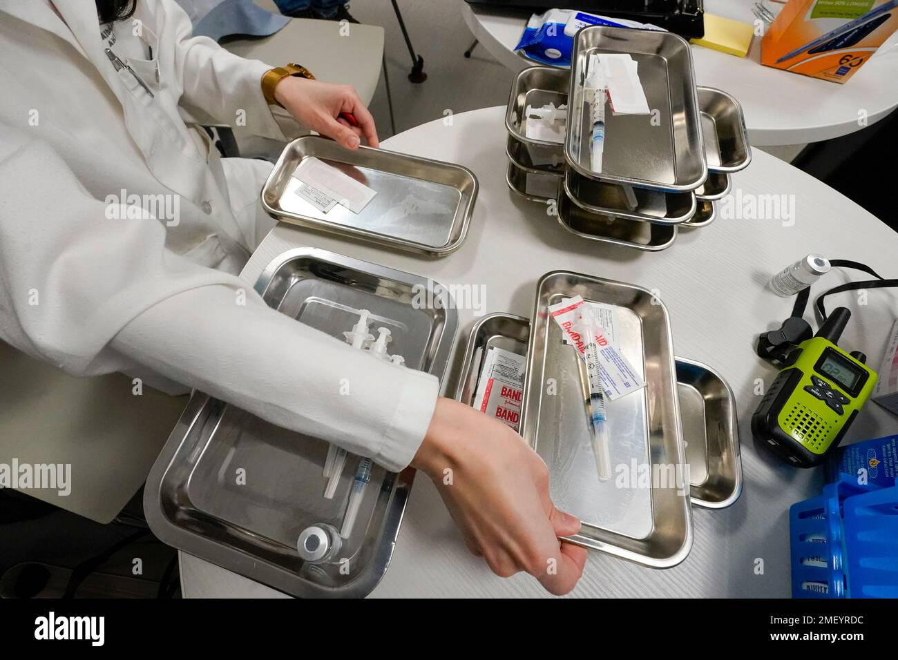 Pharmacist Mia Yu prepares syringes with the Moderna COVID19 vaccine at a pop up site at