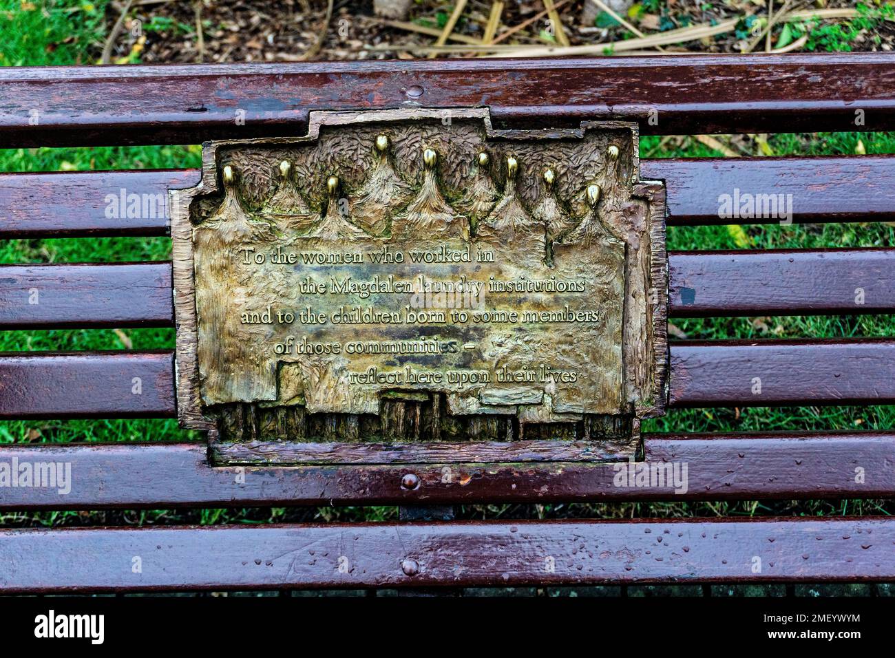 A plaque dedicated to those who worked in the Magdalen Laundry Institutions in Ireland on a bench in St Stephen’s Green. Unveiled in 1996. Stock Photo