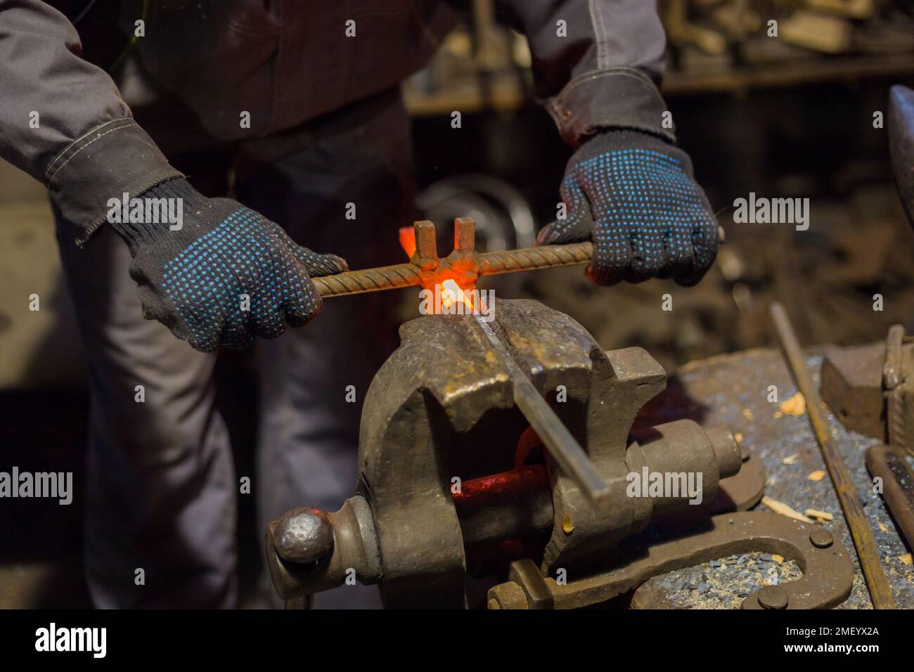 Blacksmith working with metal Stock Photo - Alamy