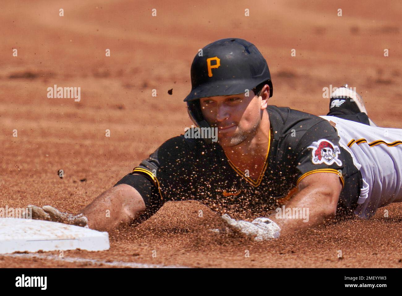 Pittsburgh Pirates' Adam Frazier slides safely into third with a
