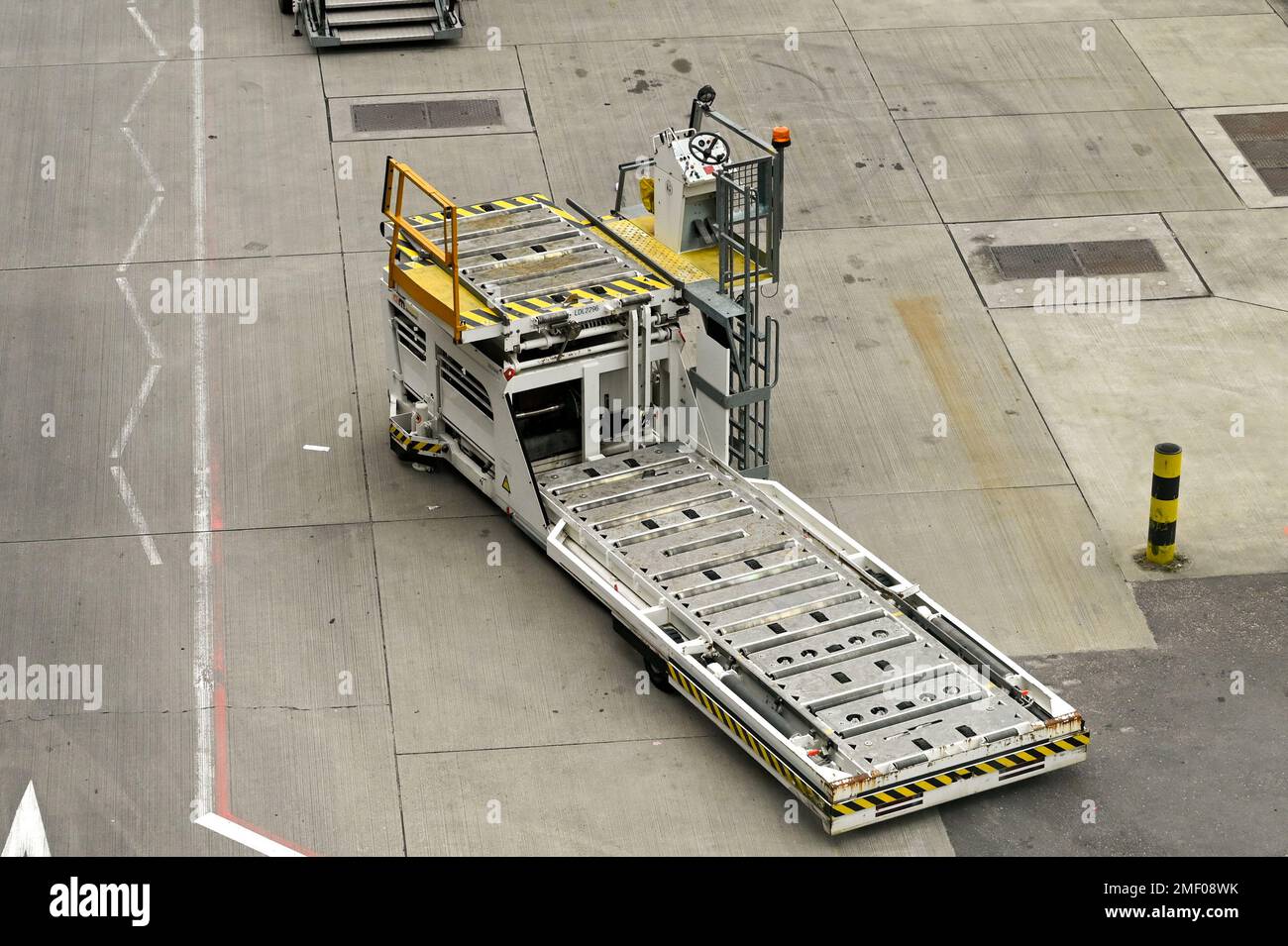 London, England - April 2022: Specialist airport vehicle for loading air freight pallets into aircraft Stock Photo
