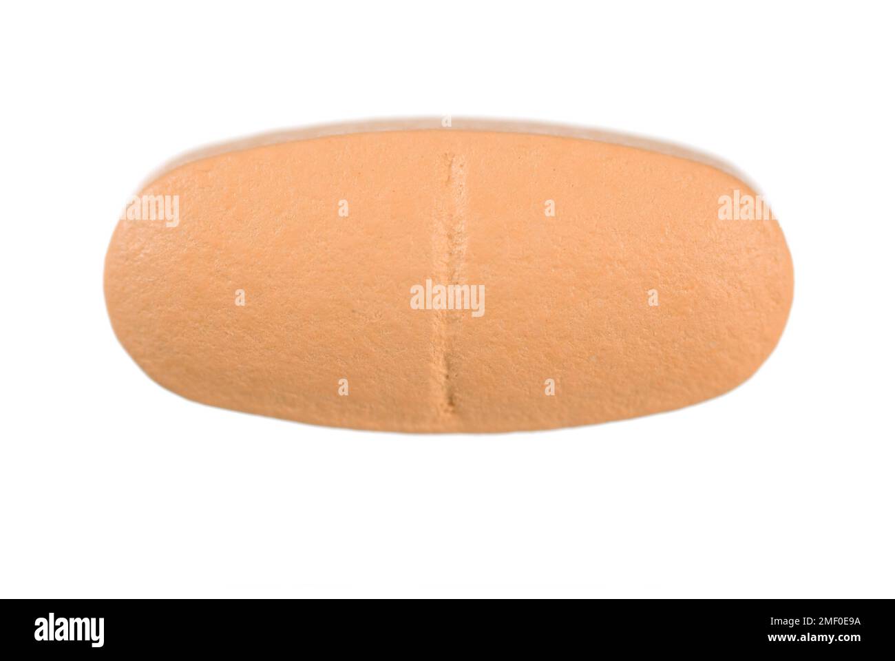 Orange vitamin pill on white Stock Photo Alamy
