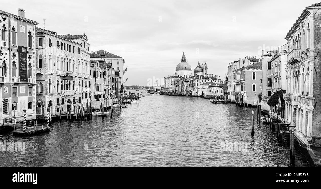 Venice, Italy - November 2022: Cityscape over Grand Canal; View from Academia Bridge overlooking the church of Saint Mary of Health, Santa Maria della Stock Photo