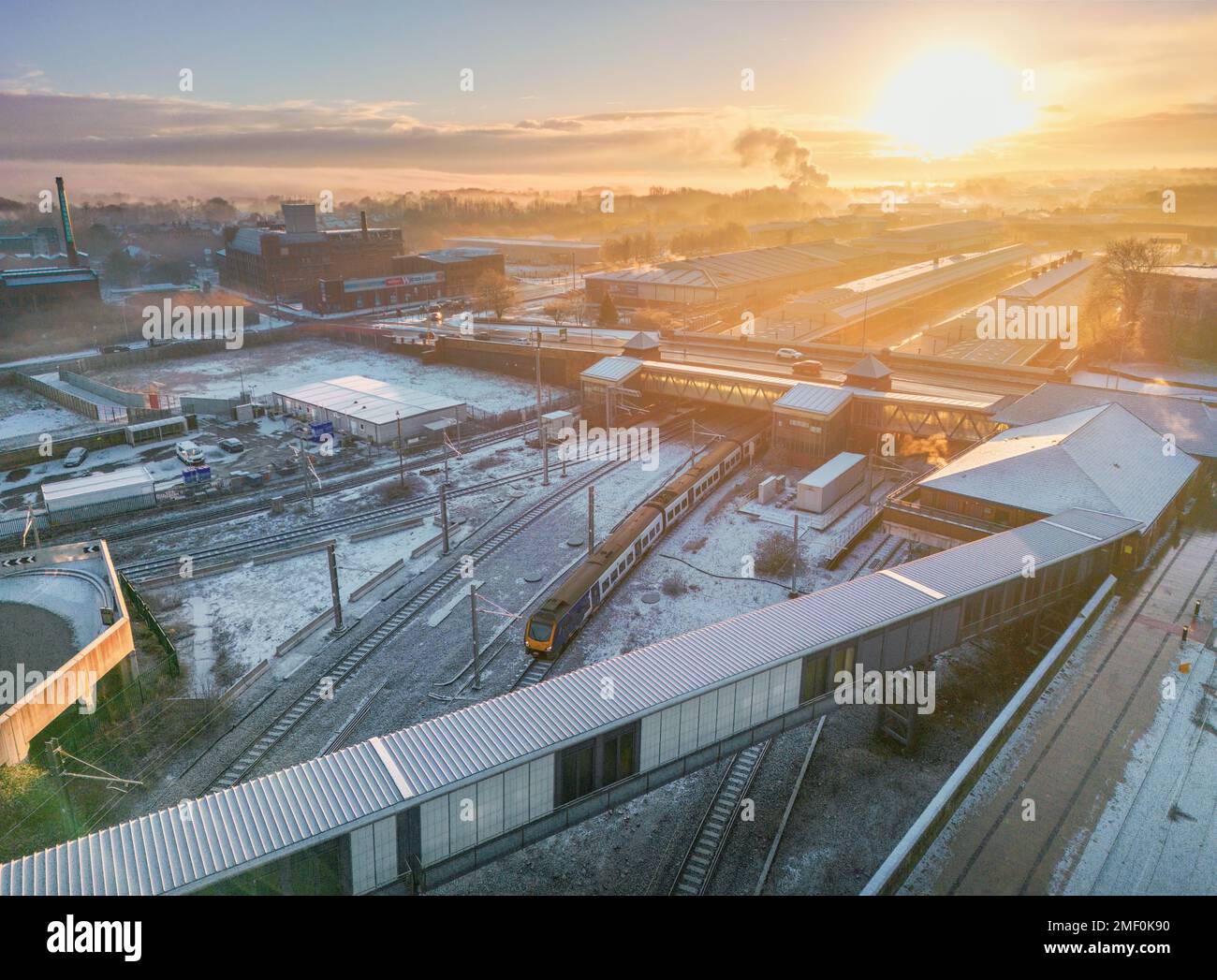 An aerial view of the Bolton station covered in snow in England, United