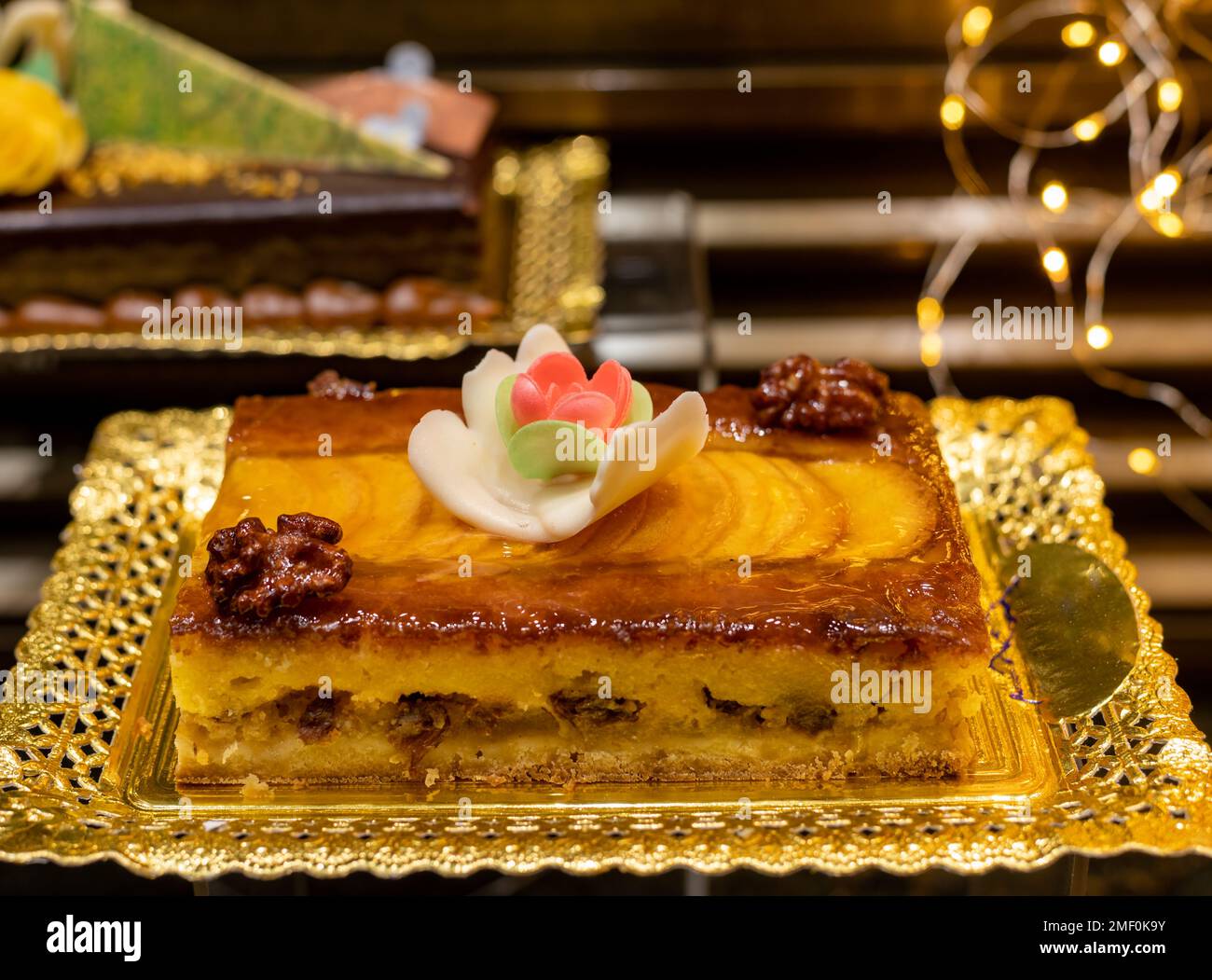 Delicious fresh baked colorful decorated cakes, tarts with cream and ...