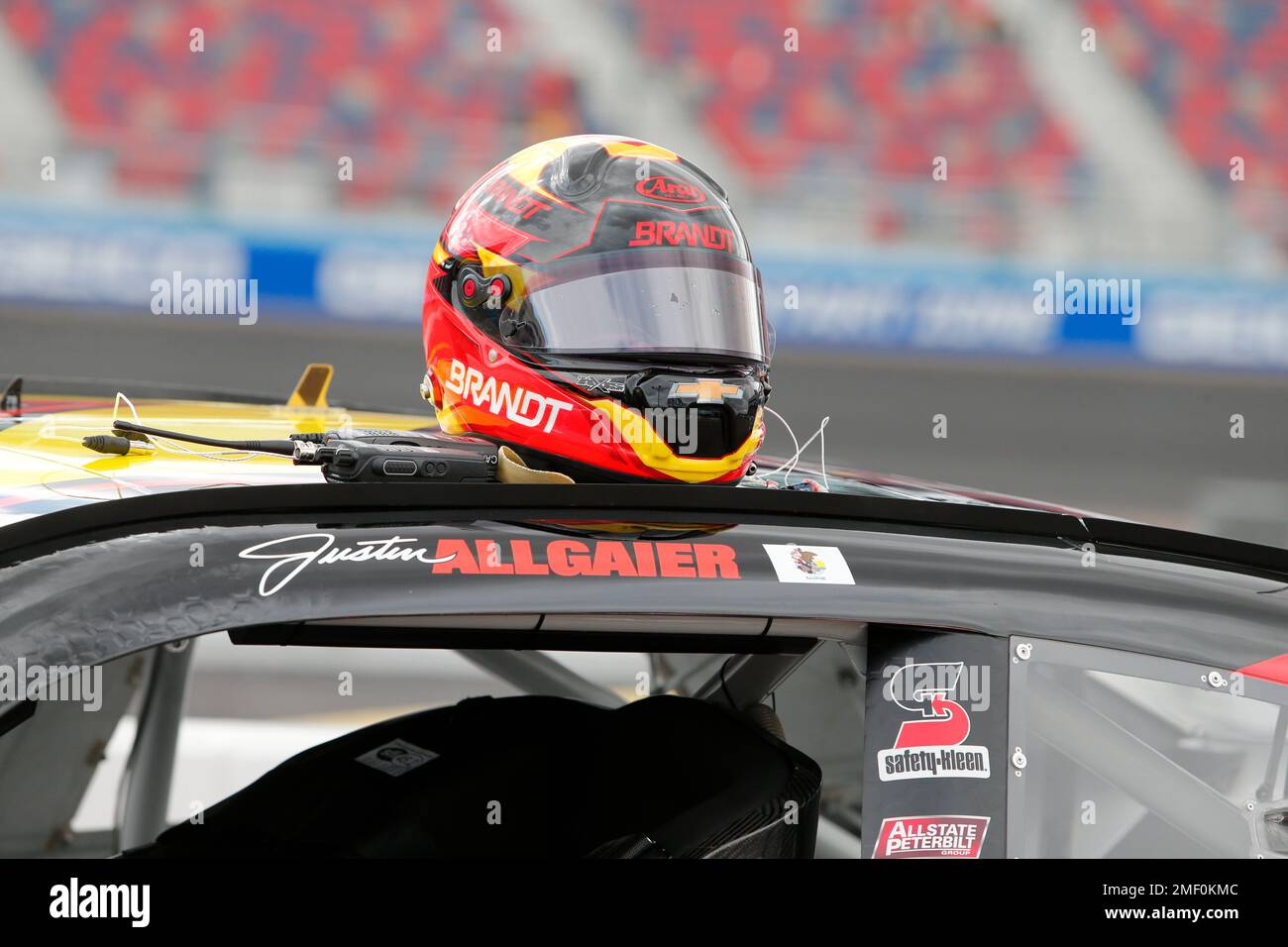 The helmet of Justin Allgaier sits on top of his race car prior to a ...