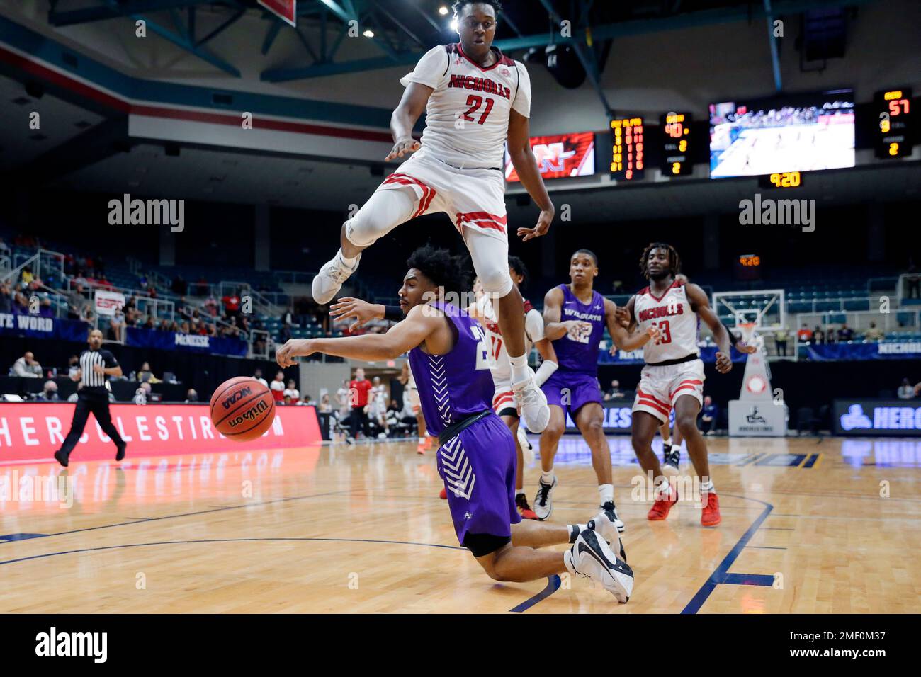 Abilene Christian guard Coryon Mason, below, loses the ball on a drive