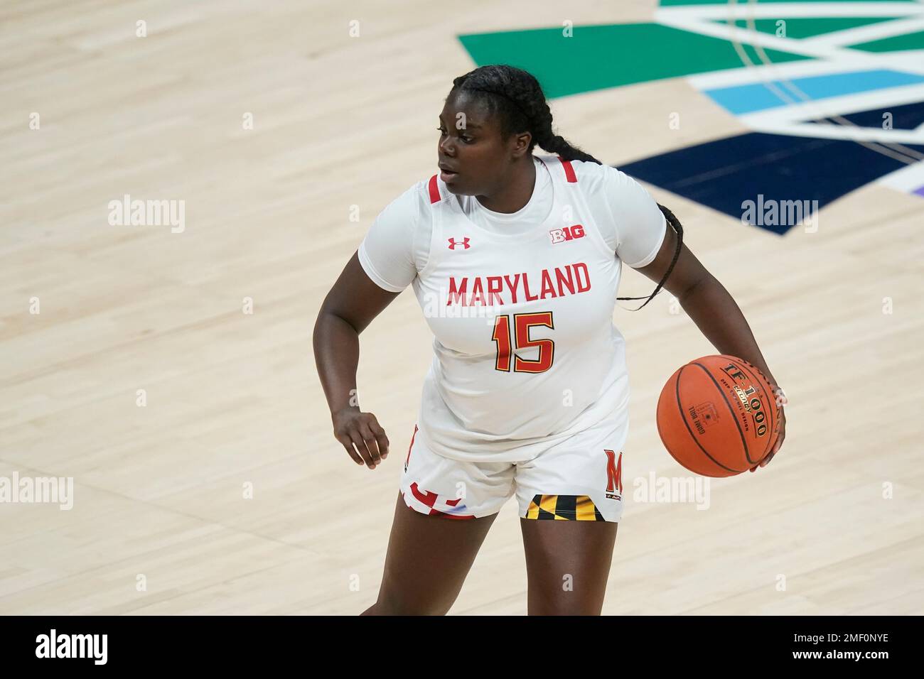 Maryland's Ashley Owusu (15) dribbles during the first half of an NCAA