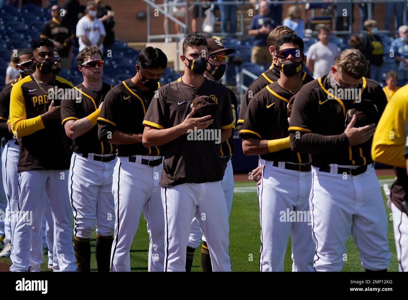 San Diego Padres players stand for the national anthem before a spring  training baseball game against the Cleveland Indians, Thursday, March 11,  2021, in Peoria, Ariz. (AP Photo/Sue Ogrocki Stock Photo - Alamy