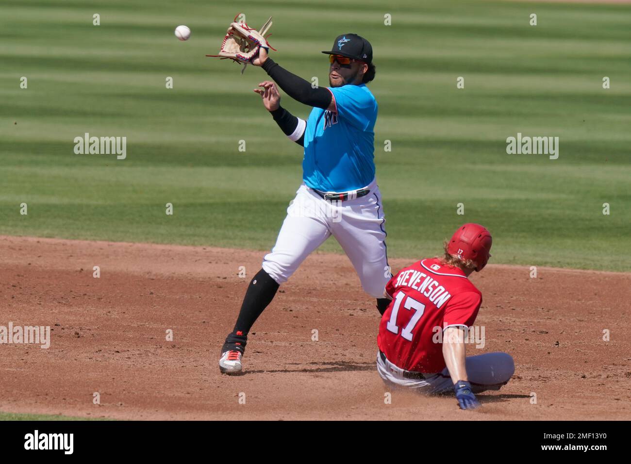 Miami Marlins second baseman Isan Diaz takes the throw as Washington