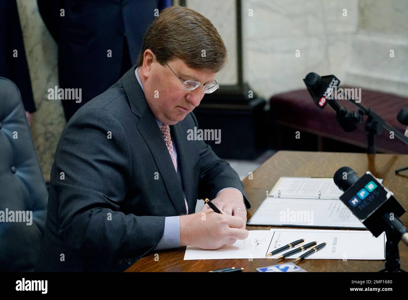 Mississippi Gov. Tate Reeves signs the first state bill in the U.S ...