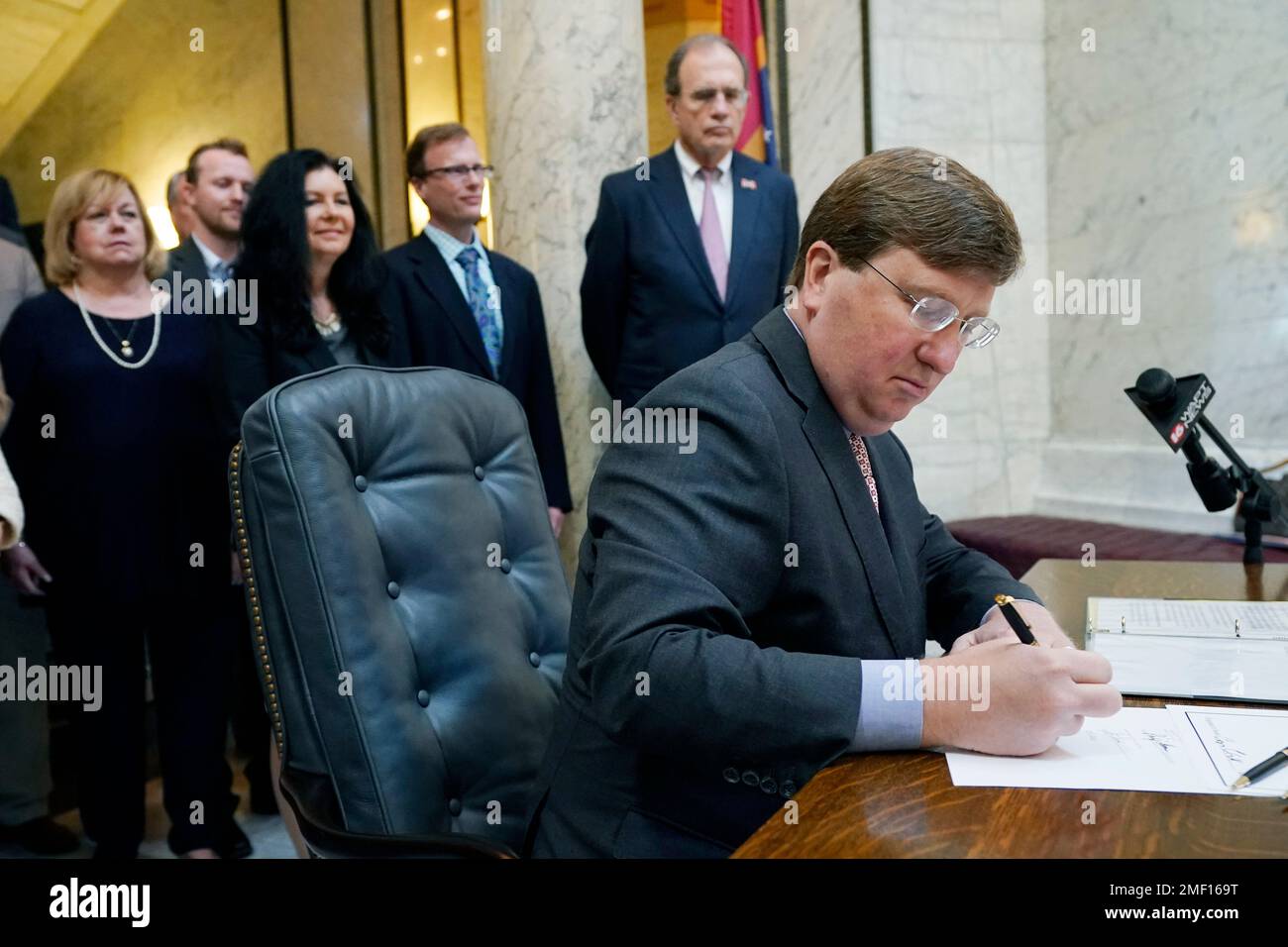 Mississippi Gov. Tate Reeves signs the first state bill in the U.S ...
