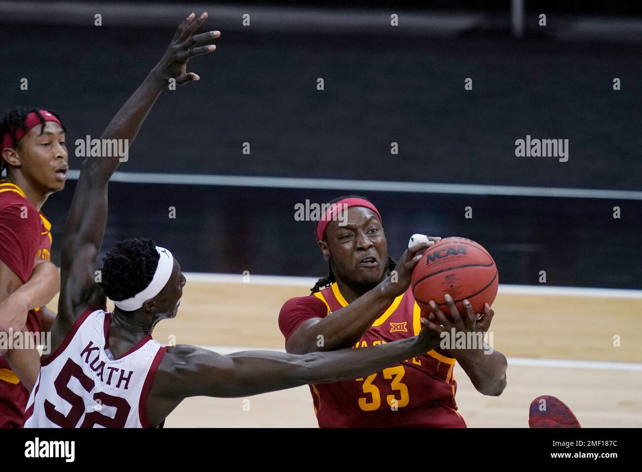Iowa State forward Solomon Young (33) pulls in a rebound next to