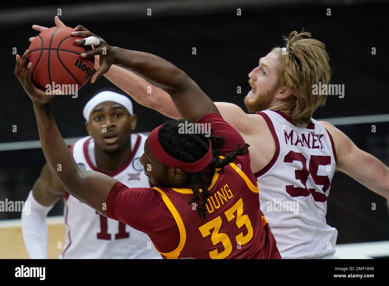 Iowa State forward Solomon Young (33) pulls in a rebound next to