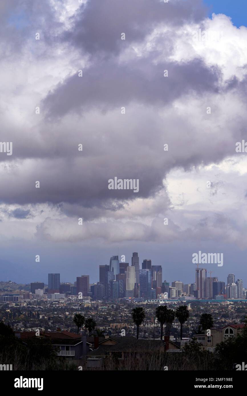 Rain clouds hover over the downtown skyline as a storm approaches ...
