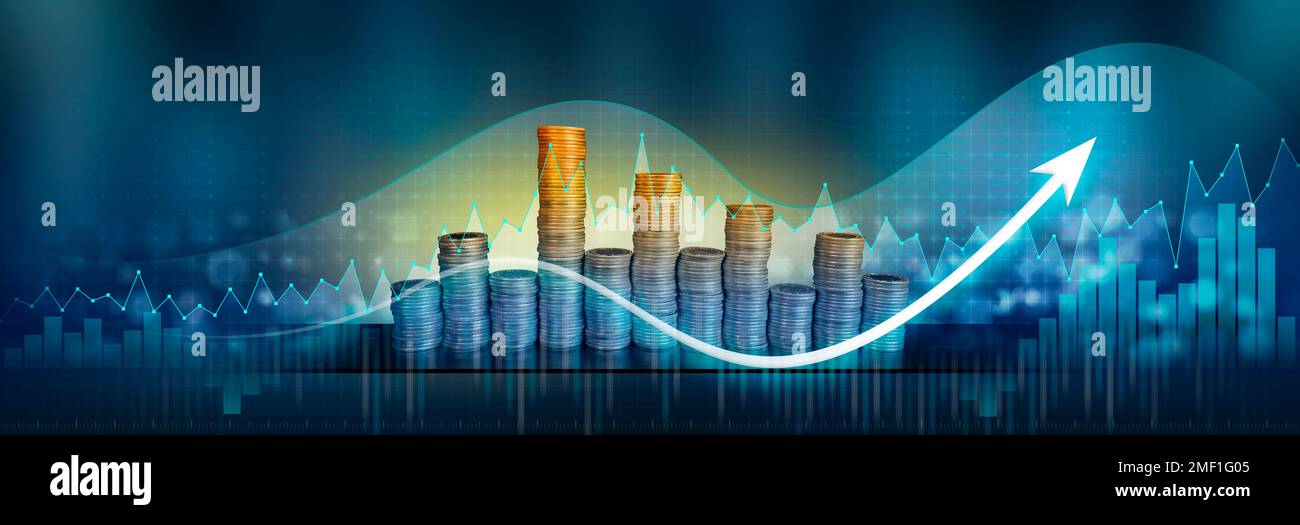 Financial bar graph with white economic growth arrow against columns of coins with yellow light against dark blue background with numbers Stock Photo