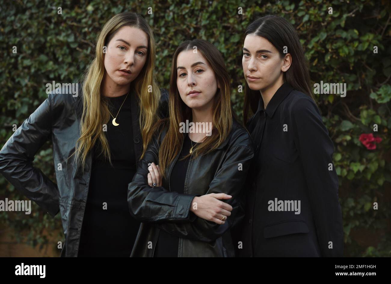 Sisters, from left, Este, Alana and Danielle Haim of the band HAIM pose