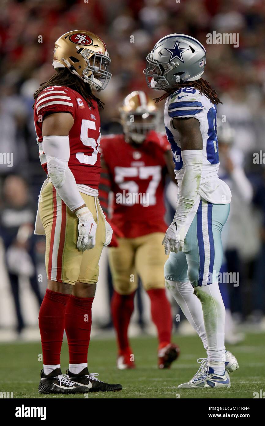 San Francisco 49ers linebacker Fred Warner (54) and Dallas Cowboys wide  receiver CeeDee Lamb (88) after a stop during an NFL divisional round  playoff football game, Sunday, Jan. 22, 2023, in Santa