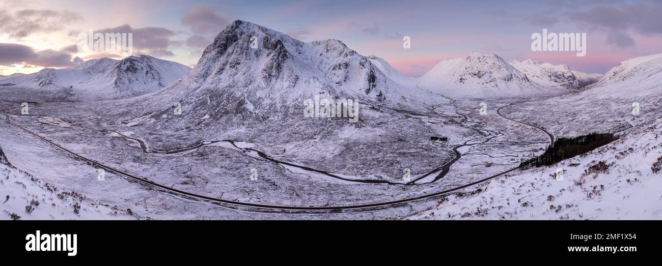 Panoramic view of Glencoe mountains on Winter sunrise, Scottish Highlands, UK. Stock Photo