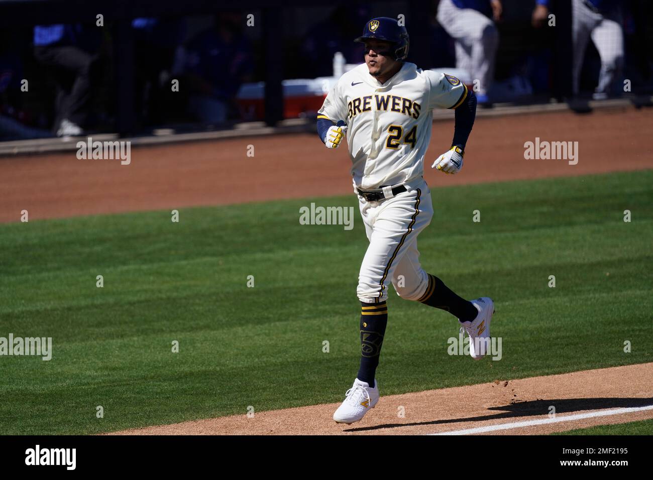 Milwaukee Brewers right fielder Avisail Garcia (24) scores on a single by  Milwaukee Brewers shortstop Orlando Arcia during the second inning of a spring  training baseball game against the Chicago Cubs Saturday