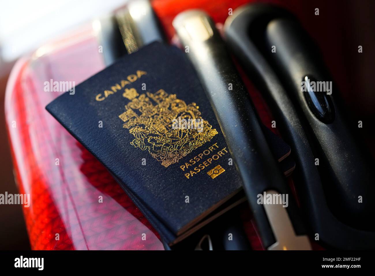 A Canadian Passport Sits On A Suitcase In Ottawa On Tuesday Jan 17 2023 Social Development Minister Karina Gould Says Service Canada Has Virtually Eliminated The Backlog Of Thousands Of Passport Applications The Canadian Presssean Kilpatrick 2MF22HF 