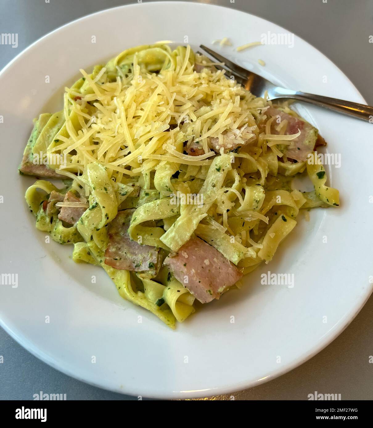 Pasta with ham and spinach Stock Photo Alamy
