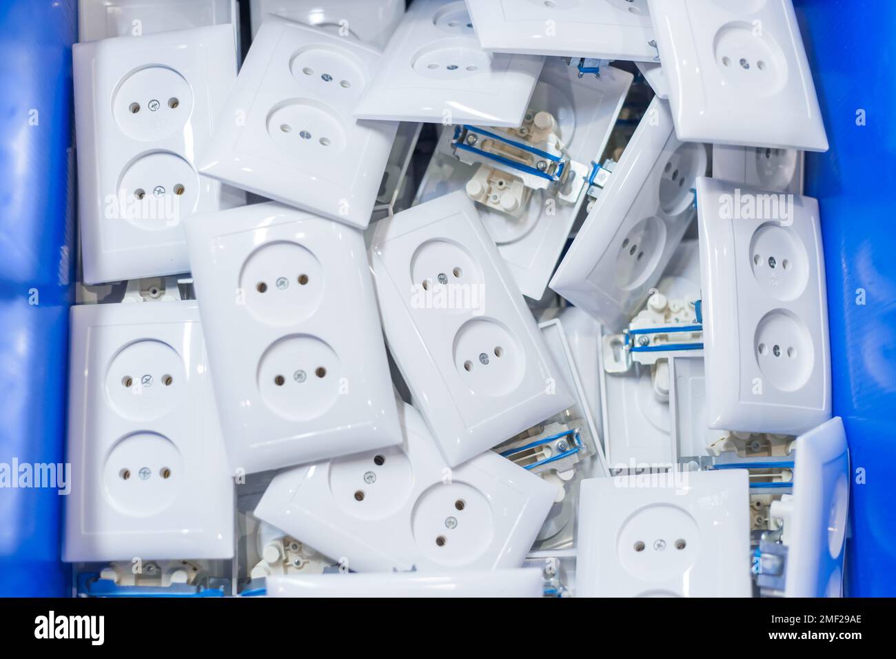 Many white electric sockets, outlets in box Stock Photo Alamy