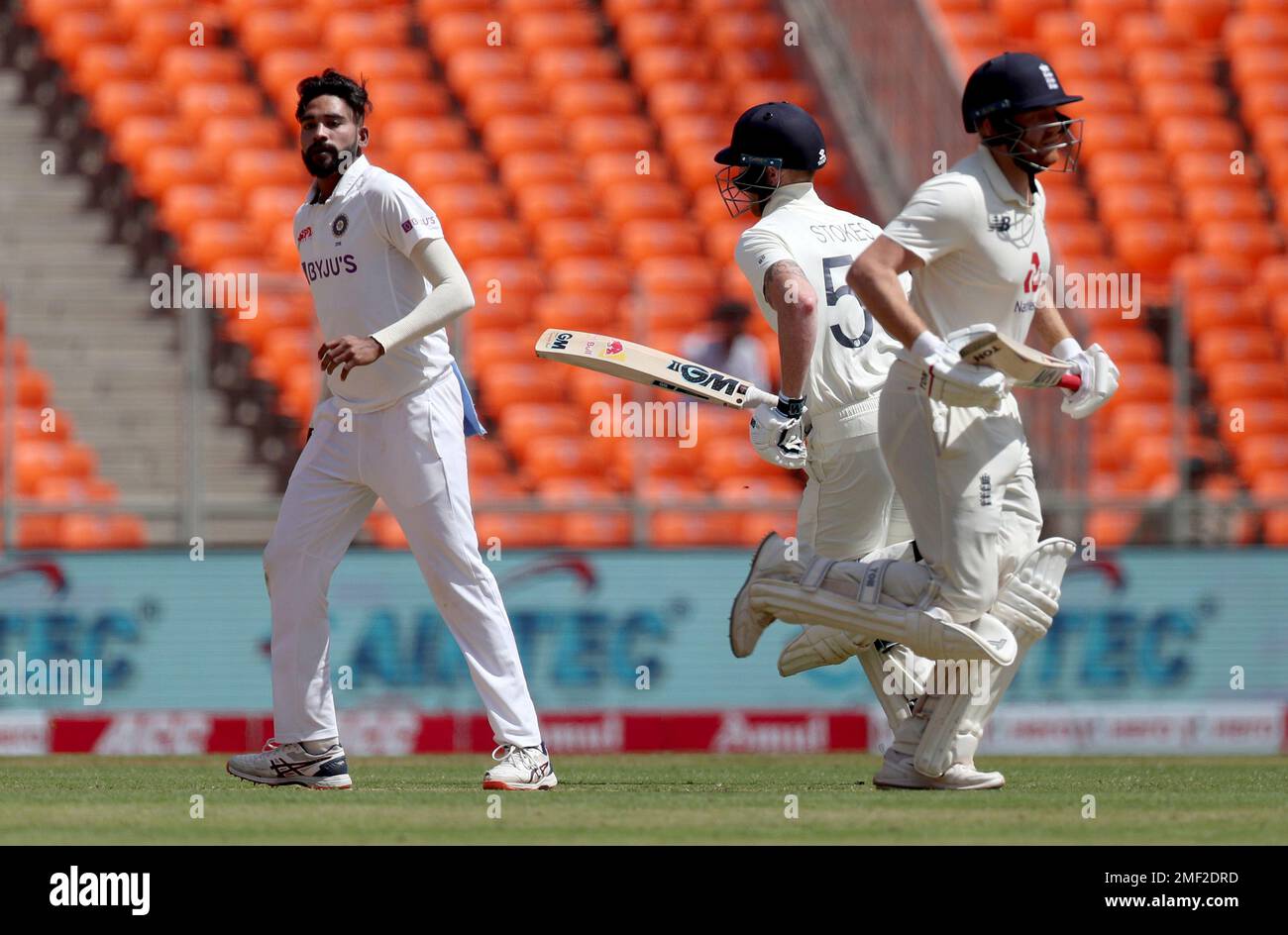 India's Mohammed Siraj, left, watches as England's Jonny Bairstow