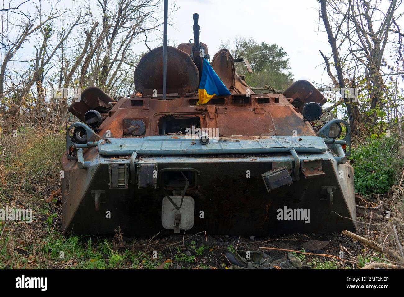 Countryside. Destroyed burnt combat vehicle in a forest area. War in Ukraine. Russian invasion of Ukraine Stock Photo
