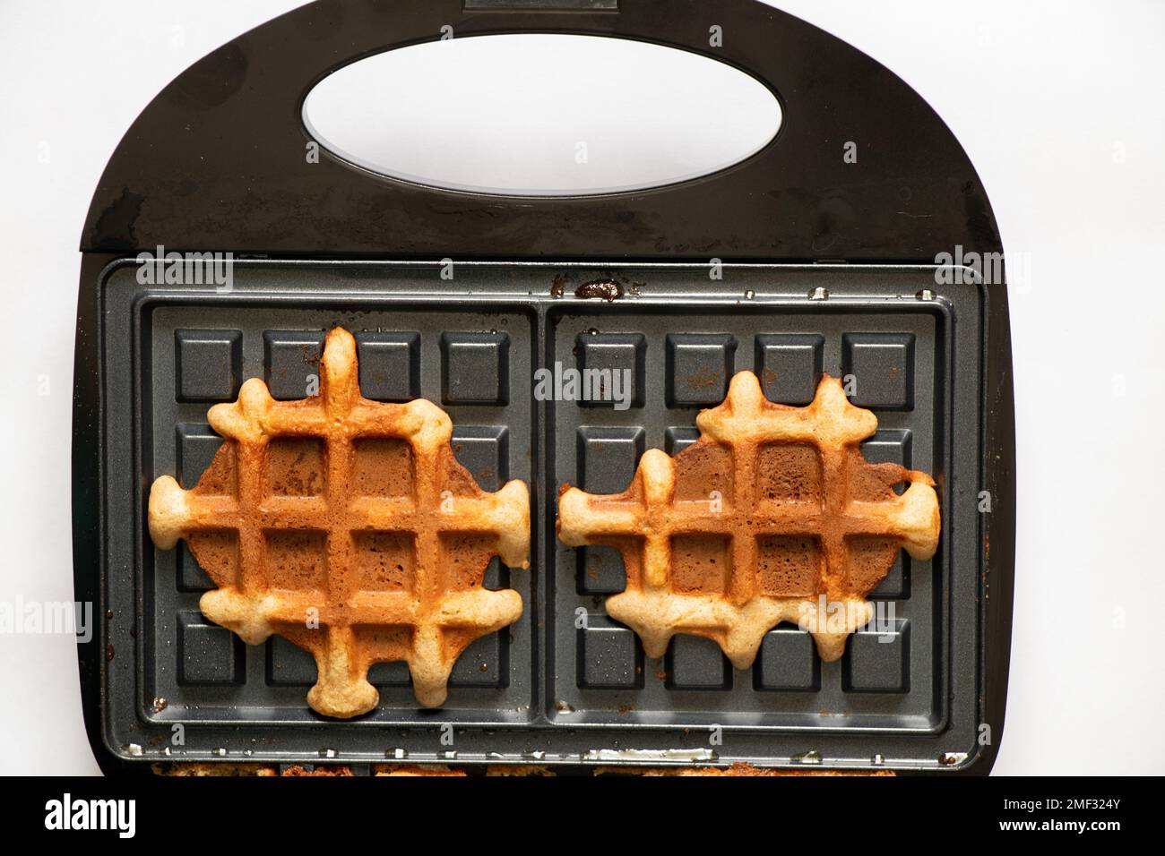 vienna waffle and waffle iron on isolated background for backgrounds