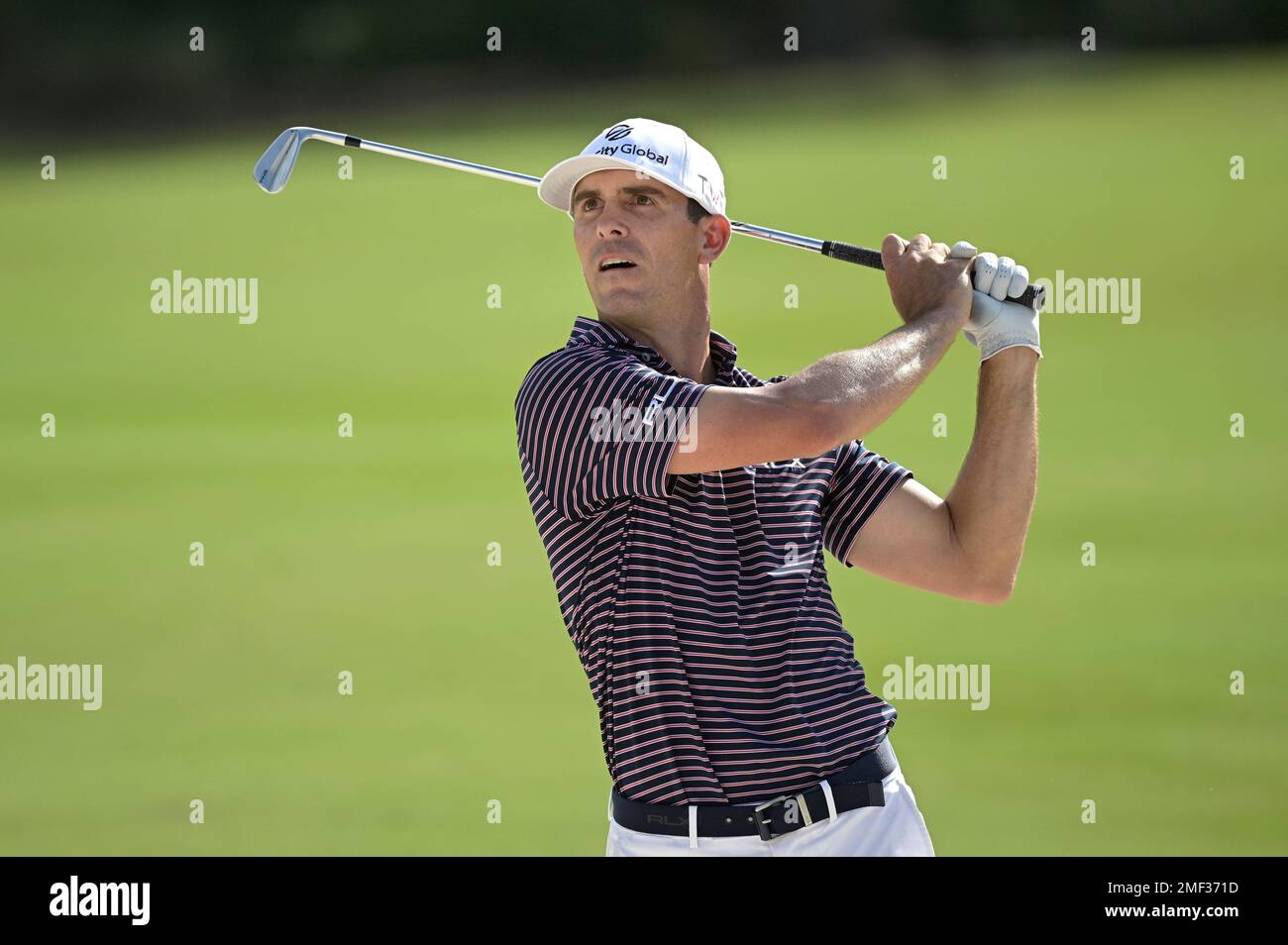 Billy Horschel watches his shot from a bunker along the ninth