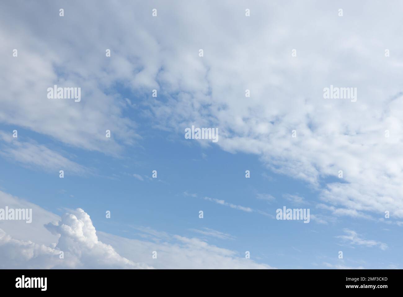 cloudy bright blue sky on a sunny day Stock Photo