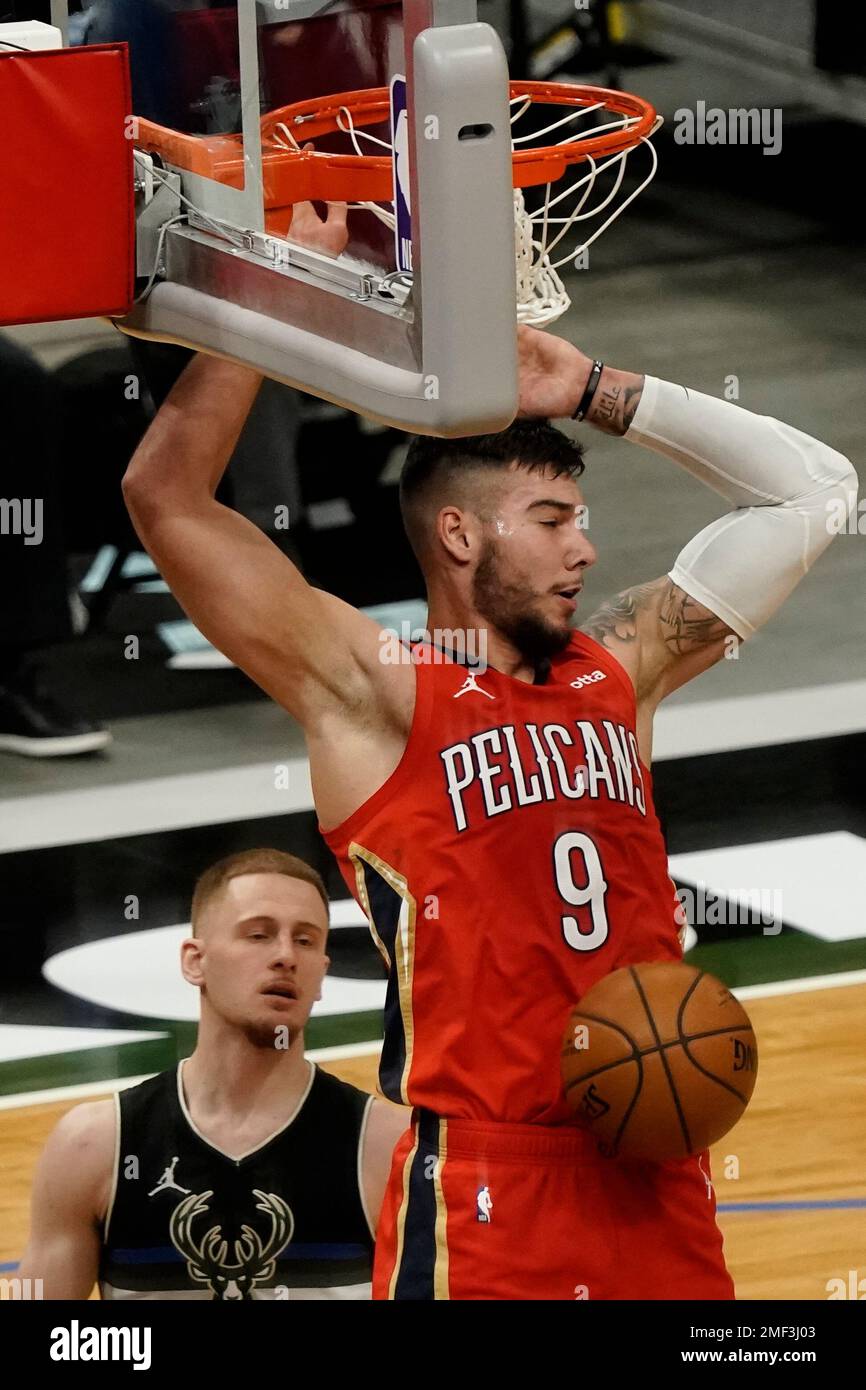 Milwaukee Bucks' Donte DiVincenzo dunks during the first half of