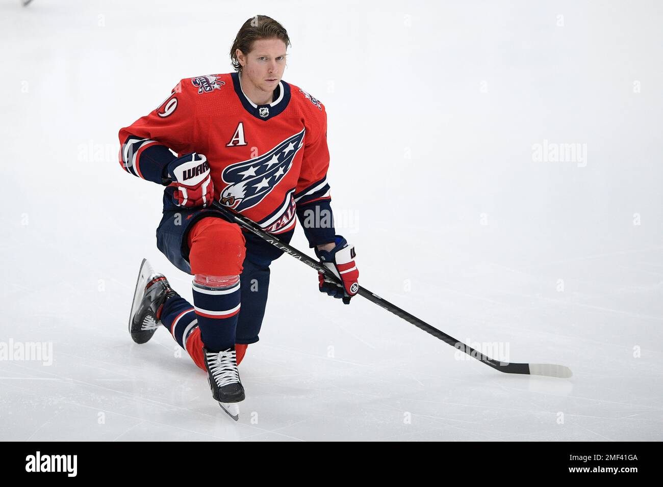 Washington Capitals center Nicklas Backstrom (19), of Sweden, wears a  camouflage jersey and cap as part of military night during warmups before  an NHL hockey game against the Colorado Avalanche, Thursday, Feb.