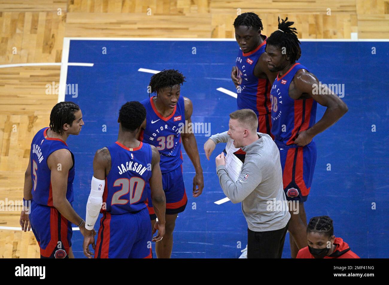 Detroit Pistons assistant coach Sean Sweeney instructs players during