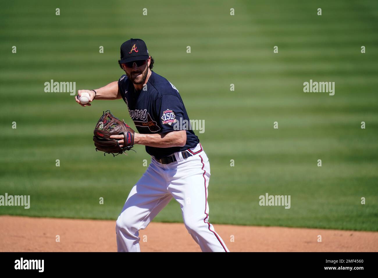 Atlanta Braves shortstop Dansby Swanson (7) throws the ball during spring  training baseball practice on Tuesday, Feb. 23, 2021, in North Port, Fla.  (AP Photo/Brynn Anderson Stock Photo - Alamy