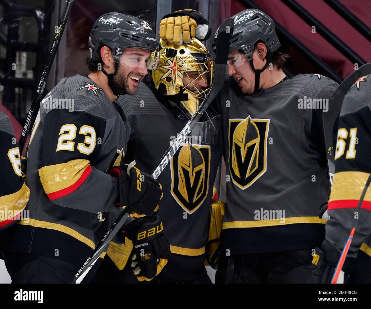 From left to right, Vegas Golden Knights defenseman Alec Martinez,  goaltender Marc-Andre Fleury and defenseman Zach Whitecloud celebrate as  time runs out in the third period of an NHL hockey game against