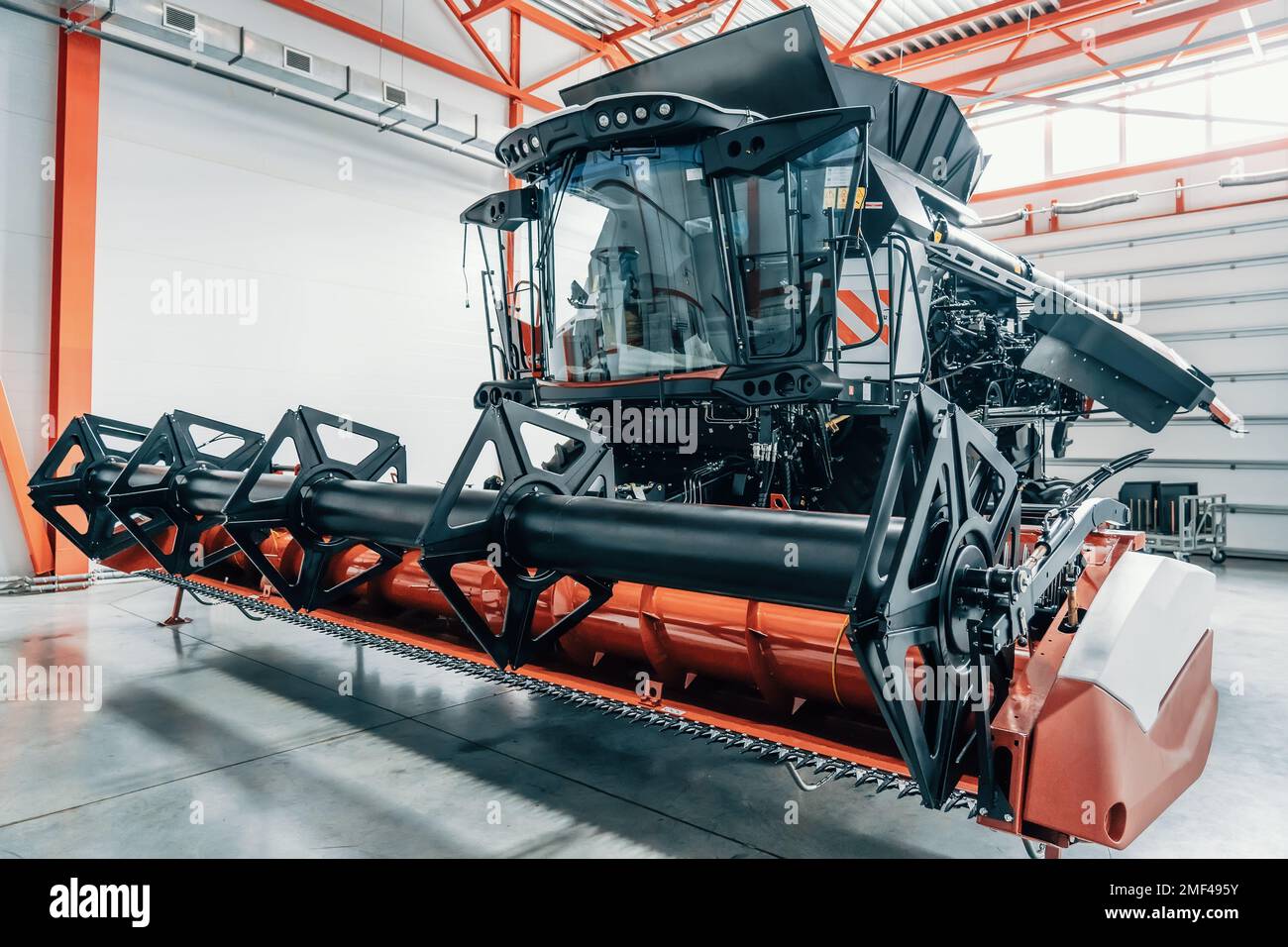 New modern industrial agriculture combine harvester in large garage. Stock Photo