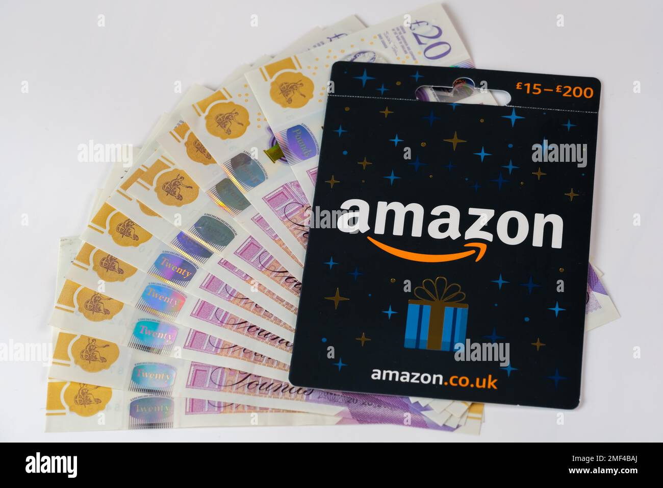 Amazon Gift Card close up image and cash. Stafford, United Kingdom