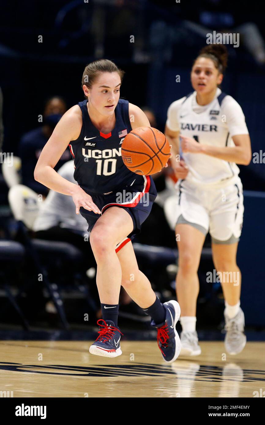 UConn guard Nika Muhl (10) dribbles against Xavier during the first half of  an NCAA college basketball game Saturday, Feb. 20, 2021, in Cincinnati. (AP  Photo/Gary Landers Stock Photo - Alamy