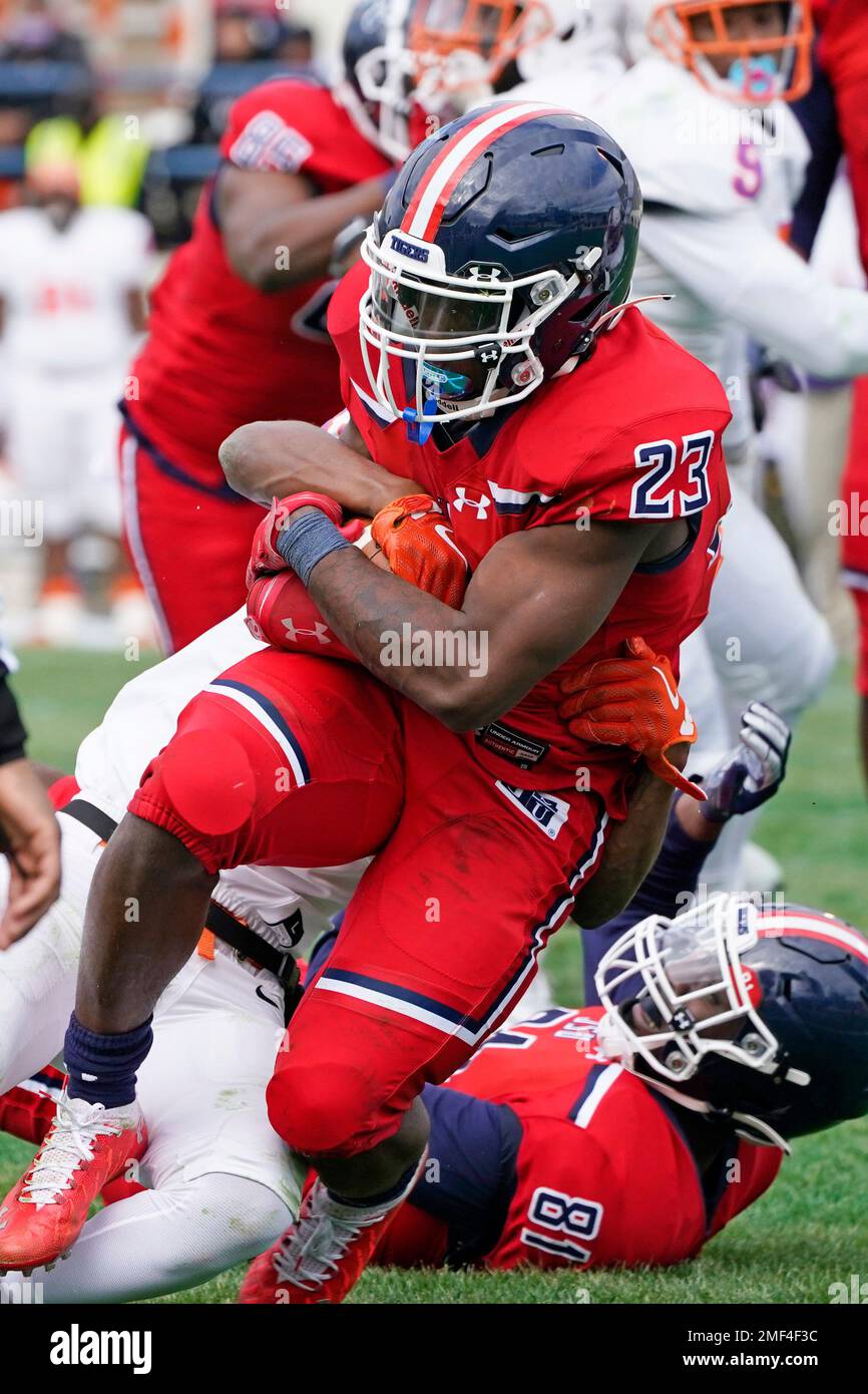 Jackson State running back Kymani Clarke (23) fights off a tackle