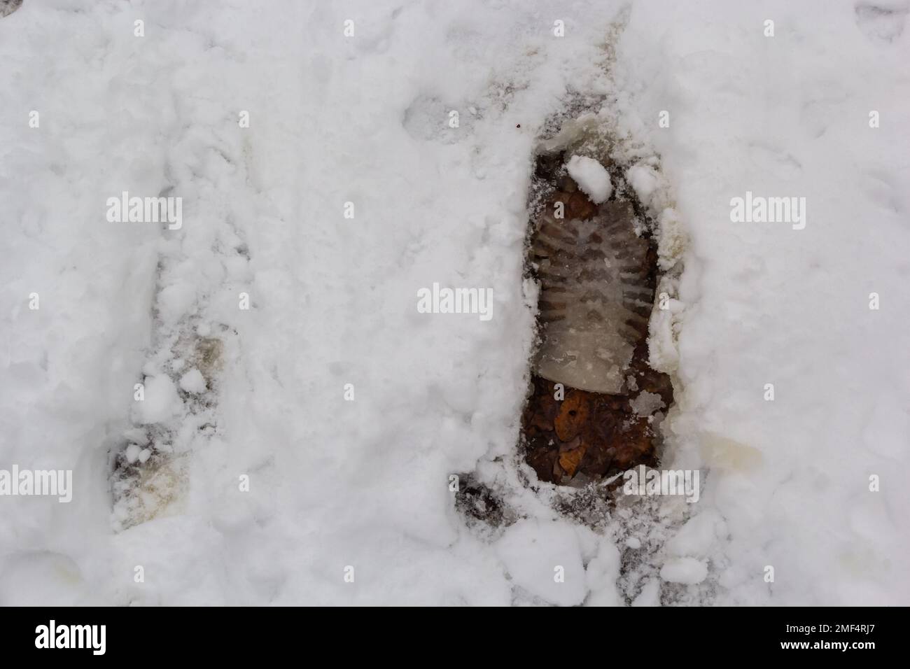 elevated view of footprint on snow covered ground. Stock Photo