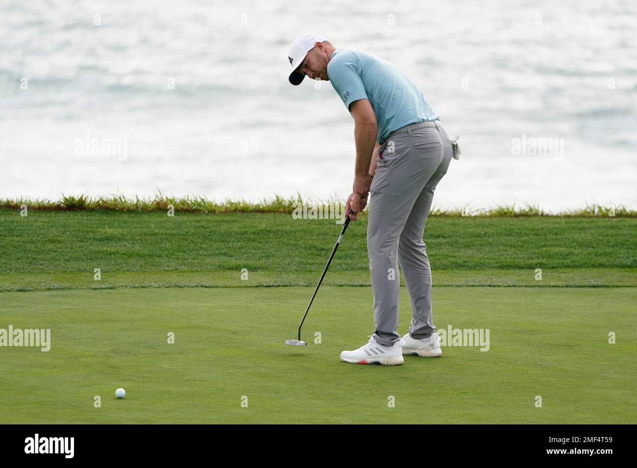 Daniel Berger putts on the ninth green of the Pebble Beach Golf Links ...